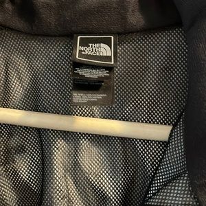 Northface black light weight rain jacket.